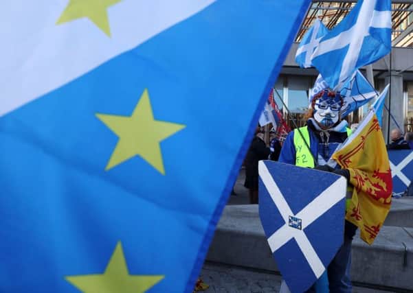 Scottish independence campaigners at a demonstration outside the Scottish Parliament in Edinburgh. Picture: Andrew Milligan/PA Wire