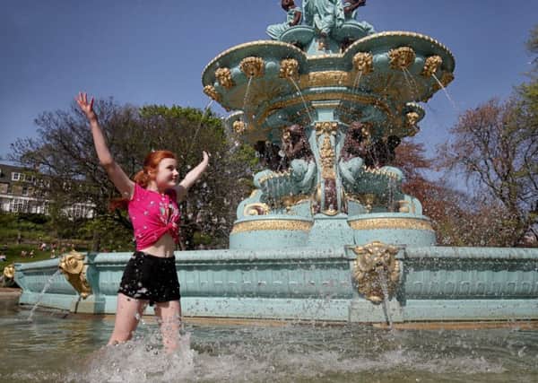 Zoe Beatson,11, cools off in the Ross Fountain in Edinburgh's Princes Street Gardens as Scotland continues to enjoy the warm Easter weather. Picture: Jane Barlow/PA Wire