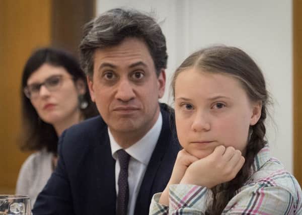 Former Labour leader Ed Miliband and Swedish climate activist Greta Thunberg at the House of Commons on Tuesday (Picture: Stefan Rousseau/PA Wire)