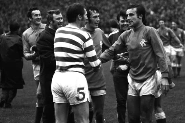 McNeill shakes hands with Ron McKinnon after the final whistle as Rangers defeat their rivals 1-0.