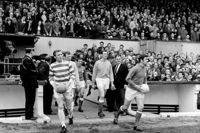 An Old Firm showdown in front of a Hampden crowd of 133,000. Celtic won the game 4-0. McNeill and John Greig of Rangers lead their teams onto the pitch.