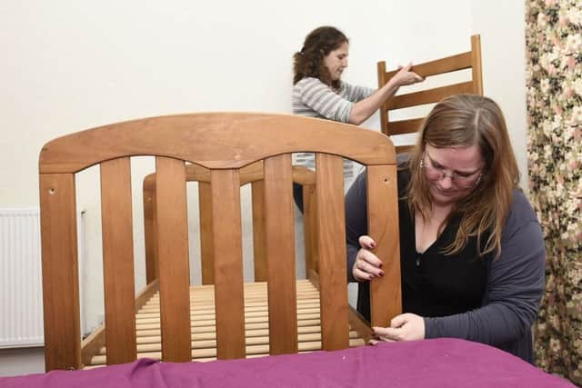 Charlotte Gibson and Nora Washbourne prepare beds. Picture: Neil Hanna