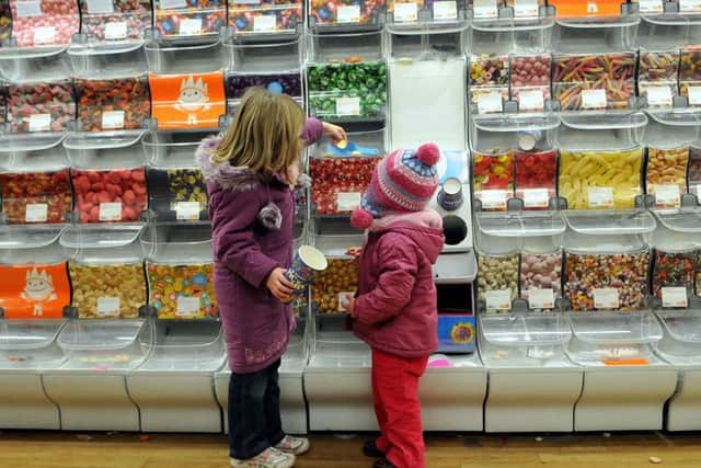Children get sweets at Kirkgate before the shop closes for good.