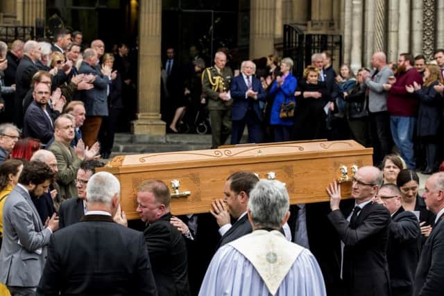Members of the NUJ provided a guard of honour and applaud as a mark of respect as the remains of murdered journalist Lyra McKee leaves St Anne's Cathedral, Belfast after her funeral. Photo: Liam McBurney/PA Wire