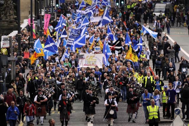 Pro-independence supporters march in Edinburgh on September 21, 2013. AFP PHOTO/ANDY BUCHANAN