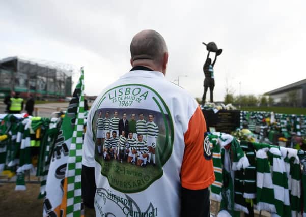 A fan pays tribute to Billy McNeill outside Celtic Park. Picture: John Devlin