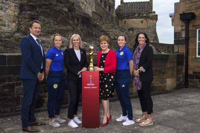 The Women's World Cup trophy at Edinburgh Castle, with (L-R): SFA chief executive Ian Maxwell, Joelle Murray, Shelley Kerr, First Minister Nicola Sturgeon, Lee Alexander and Julie Fleeting. Picture: SNS