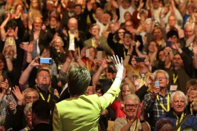 First Minister of Scotland Nicola Sturgeon waves to delegates after her speech during the SNP spring conference at the EICC in Edinburgh.Picture: PA