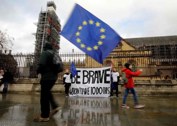 Anti-Brexit activists demonstrate outside the Houses of Parliament (Picture: Tolga Akmen/AFP/Getty Images)