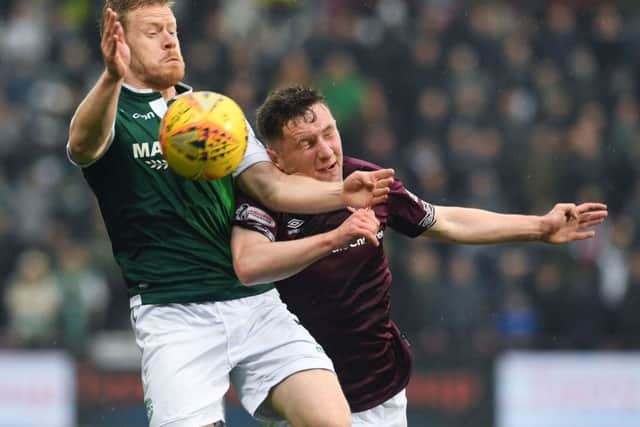 Hearts' Bobby Burns battles with Daryl Horgan of Hibs at Tynecastle. Picture: Craig Foy/SNS