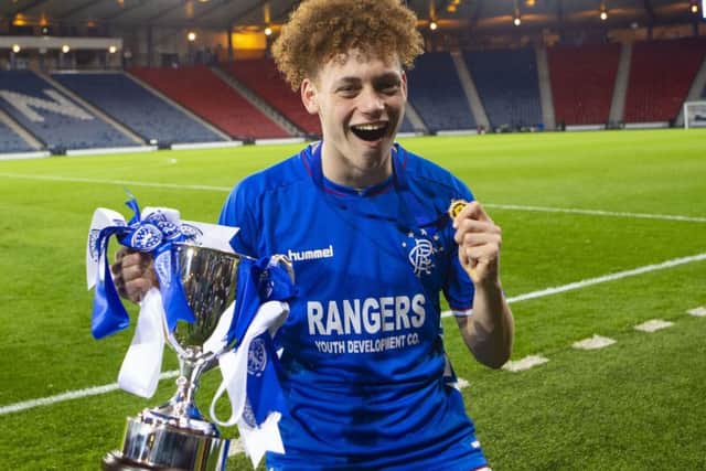 Winning goalscorer Nathan Young-Coombes with the Scottish Youth Cup at Hampden. Picture: Bruce White/SNS