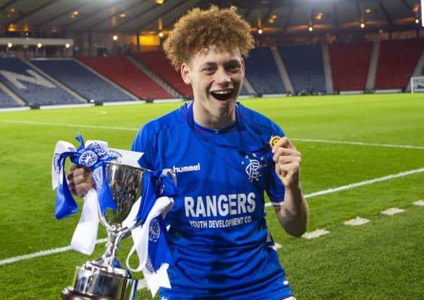 Winning goalscorer Nathan Young-Coombes with the Scottish Youth Cup at Hampden. Picture: Bruce White/SNS