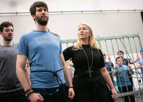 Students from the Royal Conservatoire of Scotland in rehearsal for the UK staged premiere of Dead Man Walking. From left: Rhys Thomas who plays a prison guard; Mark Nathan who plays death row prisoner Joseph De Rocher; Pedro Ometto who plays a prison guard and Carolyn Holt who plays Sister Helen Prejean. PIC: Royal Conservatoire of Scotland/Robbie McFadzean.