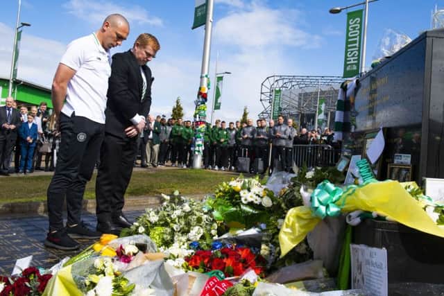 Celtic's Scott Brown and Neil Lennon lay tributes on behalf of the club to legendary European Cup winning captain Billy McNeill. Pic: SNS/Alan Harvey
