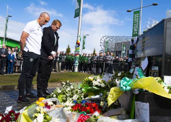 Celtic's Scott Brown and Neil Lennon lay tributes on behalf of the club to legendary European Cup winning captain Billy McNeill. Pic: SNS/Alan Harvey