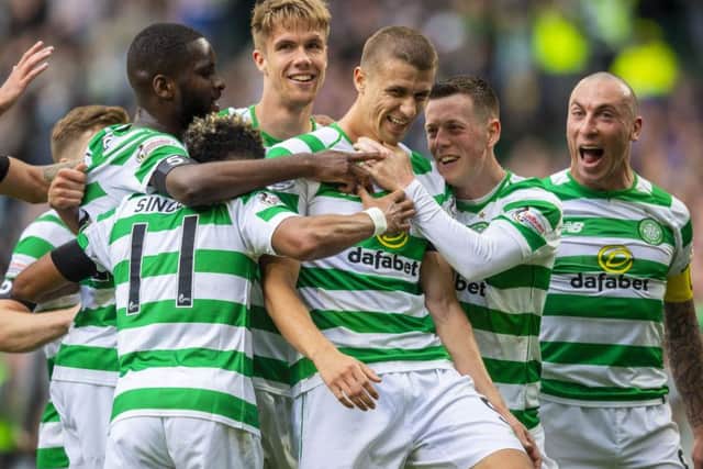 Celtic's Jozo Simunovic celebrates his winner. Pic: SNS/Craig Williamson
