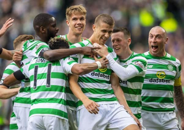 Celtic's Jozo Simunovic celebrates his winner. Pic: SNS/Craig Williamson
