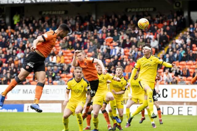 Dundee United's Rachid Bouhenna scores to put the hosts ahead. Pic: SNS/Kenny Smith