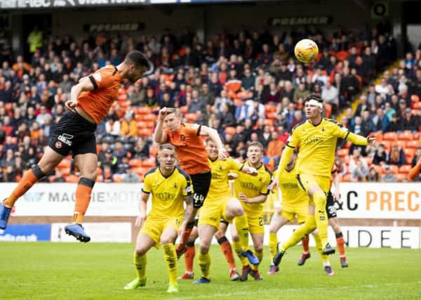 Dundee United's Rachid Bouhenna scores to put the hosts ahead. Pic: SNS/Kenny Smith