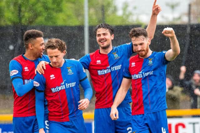 Charlie Trafford celebrates his winner with Joe Chalmers, Tom Walsh and Nathan Austin. Pic: SNS/Ian Georgeson