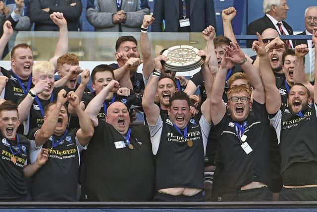 Berwick captain Tom Jackson lifts the Shield. Pic: Neil Hanna