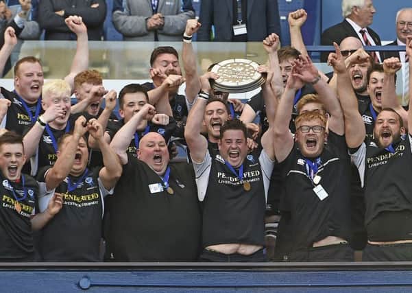 Berwick captain Tom Jackson lifts the Shield. Pic: Neil Hanna