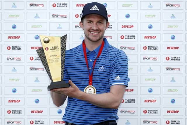Connor Syme shows off the Turkish Airlines Challenge after his victory at Samsun Golf Club in Akatum on the Black Sea coast. Picture: Getty Images