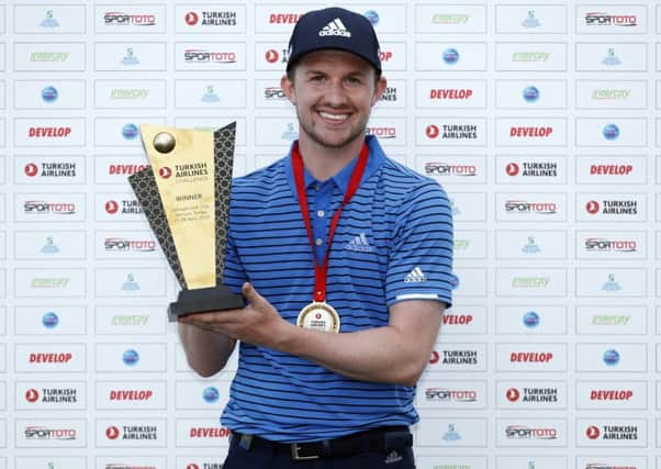 Connor Syme shows off the Turkish Airlines Challenge after his victory at Samsun Golf Club in Akatum on the Black Sea coast. Picture: Getty Images