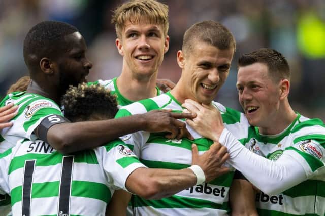 Kristoffer Ajer, centre, congratulates Simunovic on his goal. Picture: SNS Group