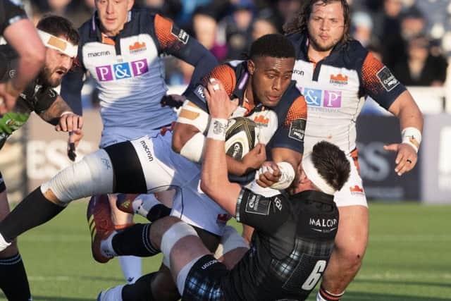 Edinburghs Viliame Mata is tackled by Glasgow Warriors Ryan Wilson during the home sides 34-10 victory at Scotstoun on Staturday. Picture: SNS/SRU.