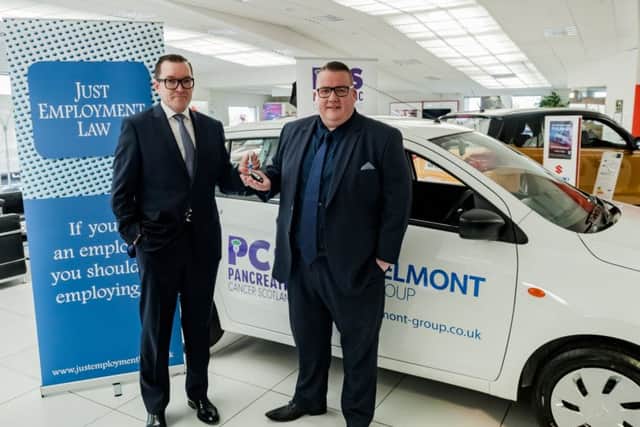 David McRae (right) gave away a new car to a lucky guest at last years Summer Ball in Glasgow. Picture: Contributed