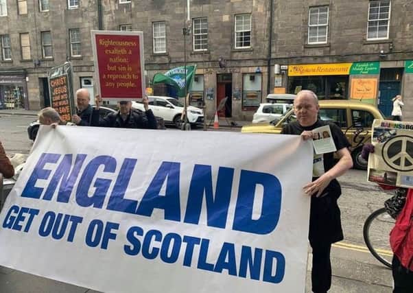 Sean Clerkin was pictured with the banner in Edinburgh.
