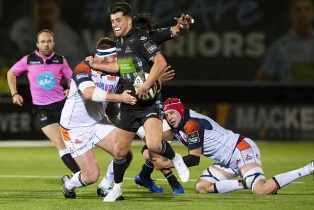 Glasgow
Warriors' Adam Hastings is tackled by Edinburgh's Simon Berghan. Picture: SNS