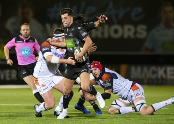 Glasgow 
Warriors' Adam Hastings is tackled by Edinburgh's Simon Berghan. Picture: SNS