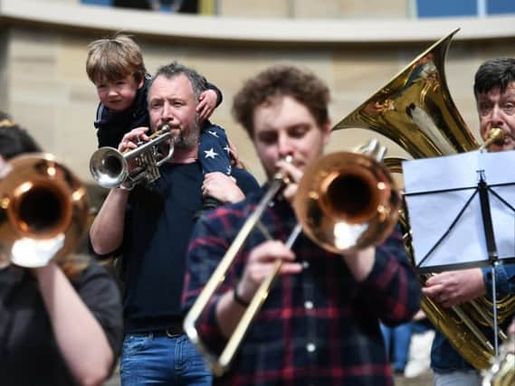 Musicians gathered to protest over councils's charging policies for musical instrument lessons.