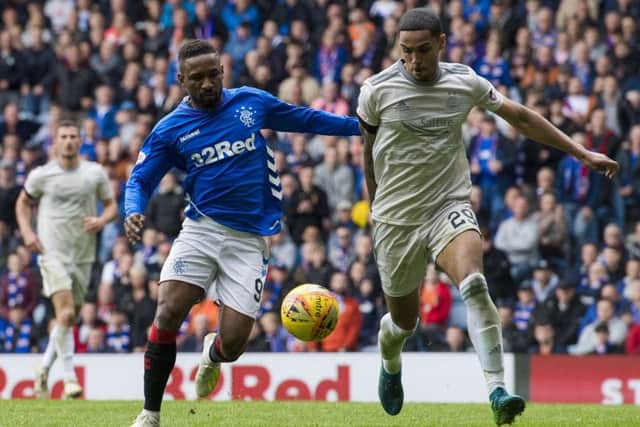 Aberdeen's Max Lowe, right, with Rangers' Jermain Defoe. Picture: SNS