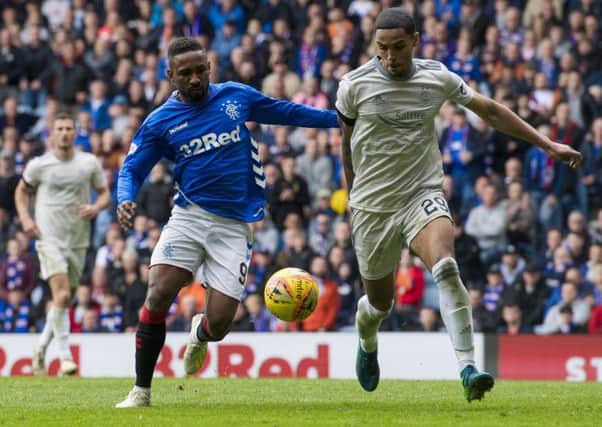 Aberdeen's Max Lowe, right, with Rangers' Jermain Defoe. Picture: SNS