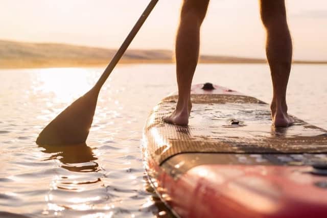 Stand-up paddleboarding is good for the mind and body (picture: Shutterstock).
