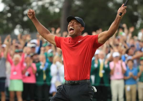 Tiger Woods roars with joy after ending an 11-year drought in majors as he won The Masters last month. Picture: Andrew Redington/Getty