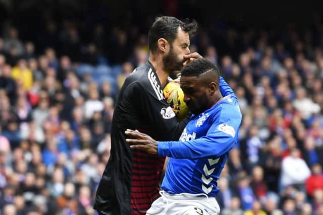 Jermain Defoe of Rangers clashes with Aberdeen's Joe Lewis. Picture: SNS Group