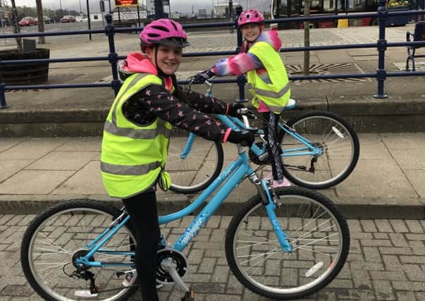 At the start of their cycle, Mariska Silkowski (black jacket) and Emma McDade.
