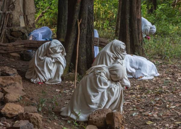 Kieran Dodds' picture for the Ambit exhibition at Stills shows worshippers dressed in their Sunday robes in Zhara church forest, Ethiopia