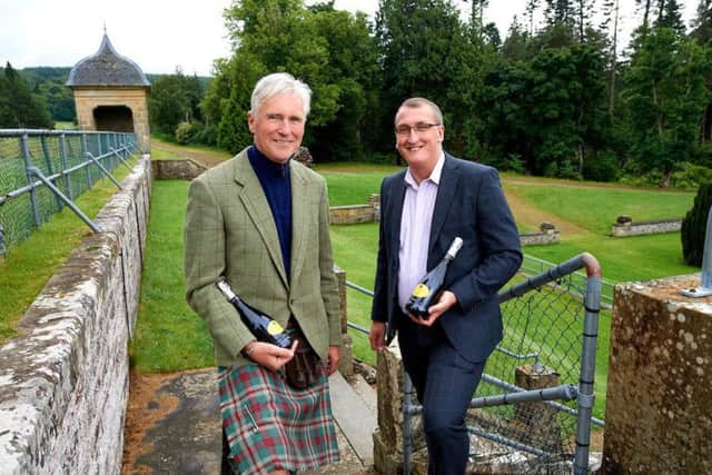 Joe Gibbs of Belladrum Festival (left) with Alasdair Fowle of the Co-op. Picture: contributed.