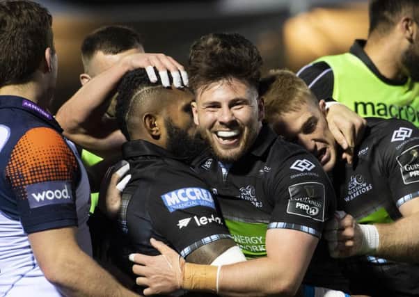 Glasgow scrum-half Ali Price, centre, celebrates a try for his side during the 34-10 victory over Edinburgh at Scotstoun last weekend. Picture: SNS/SRU
