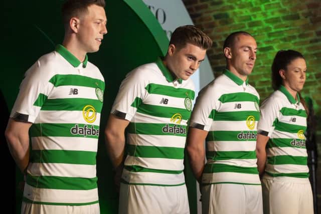 Callum McGregor, James Forrest, Scott Brown and Kelly Clark show off the new Celtic kit. Picture: SNS