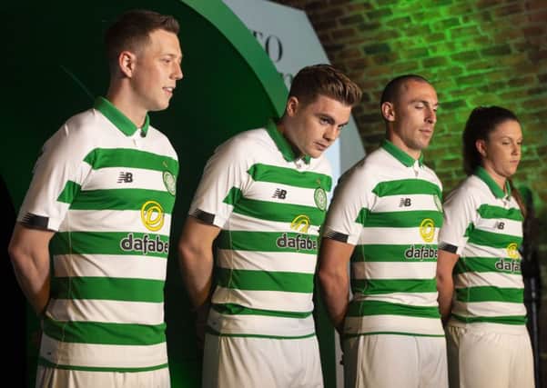 Callum McGregor, James Forrest, Scott Brown and Kelly Clark show off the new Celtic kit. Picture: SNS