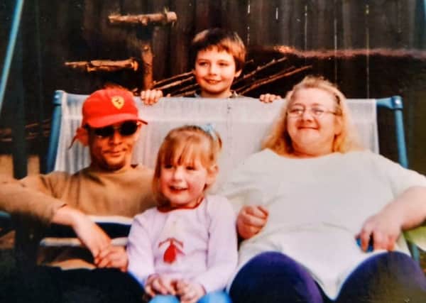 Eileen Bunting pictured with son Mark and grandchildren Bethany and Joshua in 2004. Picture: SWNS