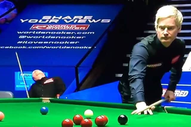 Neil Robertson at the table with John Higgins in the background. Picture: Contributed/BBC
