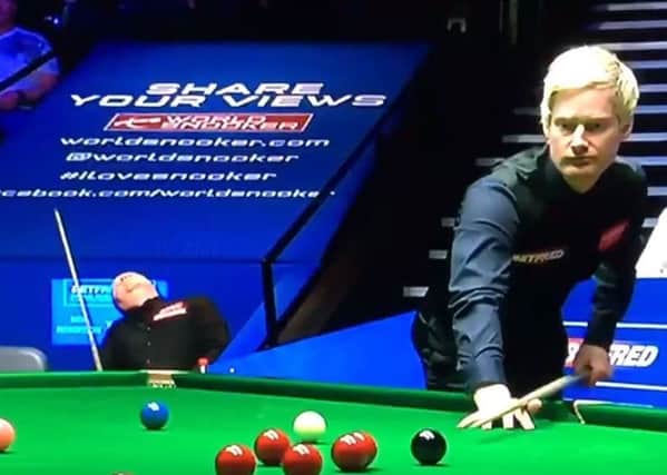 Neil Robertson at the table with John Higgins in the background. Picture: Contributed/BBC