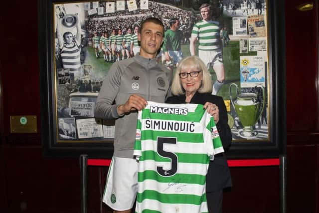 Jozo Simunovic presents his No.5 shirt to Billy McNeill's widow Liz. Picture: SNS Group